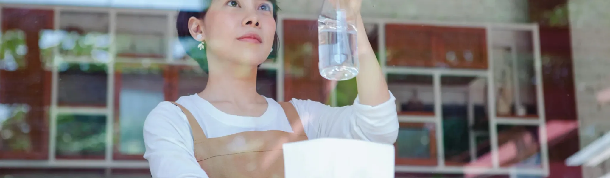 Chef performing temperature checks in commercial kitchen with digital thermometer