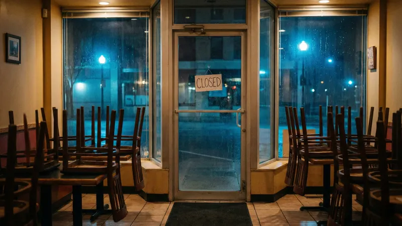 Empty restaurant tables representing lost revenue from food safety non-compliance